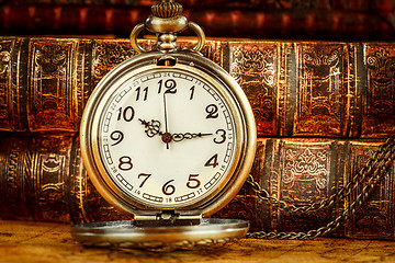 Image showing Old Books and Vintage pocket watch