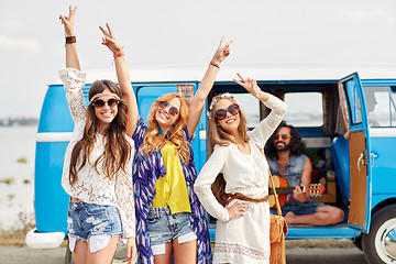 Image showing happy hippie friends having fun over minivan car