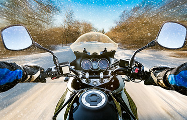 Image showing Biker First-person view. Winter slippery road