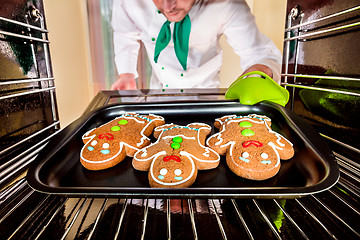 Image showing Baking Gingerbread man in the oven