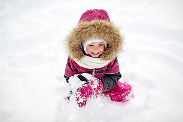 Image showing f happy little child or girl with snow in winter