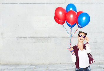 Image showing happy teenage girl with helium balloons