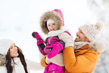 Image showing happy family with child in winter clothes outdoors