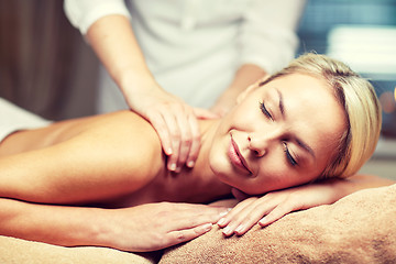 Image showing close up of woman lying and having massage in spa