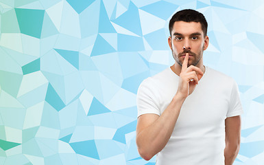 Image showing man making hush sign over low poly background