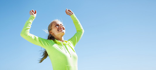 Image showing woman runner celebrating victory