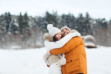 Image showing happy couple hugging and laughing in winter