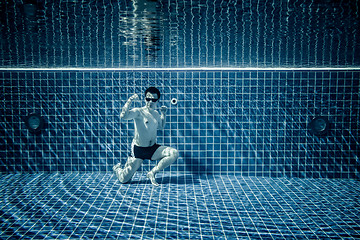 Image showing Underwater pool portraying Superman