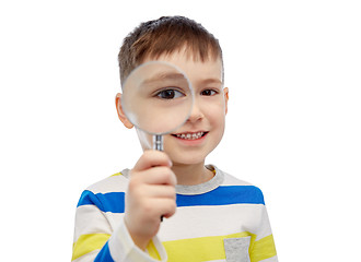 Image showing happy little boy looking through magnifying glass