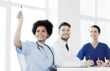 Image showing group of happy doctors on conference at hospital