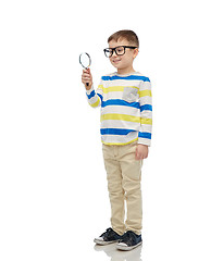 Image showing little boy in eyeglasses with magnifying glass