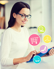 Image showing smiling woman with tablet pc shopping online