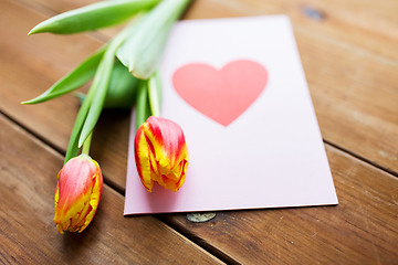 Image showing close up of flowers and greeting card with heart