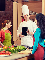 Image showing happy women with chef and tablet pc in kitchen