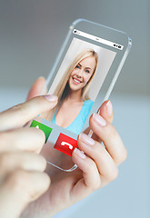 Image showing close up of woman with incoming call on smartphone