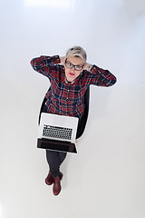 Image showing top view of young business woman working on laptop computer