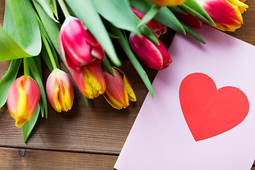 Image showing close up of flowers and greeting card with heart
