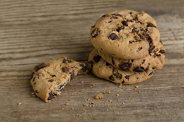 Image showing Brown cookies on wooden background