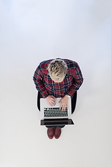 Image showing top view of young business woman working on laptop computer