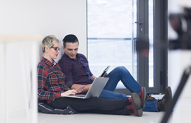 Image showing startup business, couple working on laptop computer at office