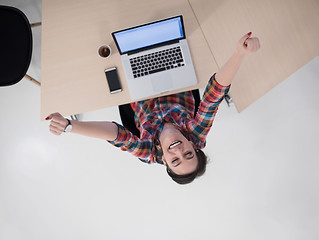 Image showing top view of young business woman working on laptop