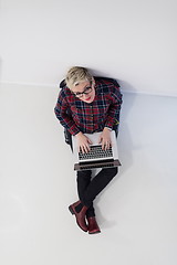 Image showing top view of young business woman working on laptop computer