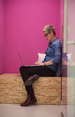 Image showing woman in crative box working on laptop