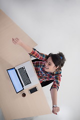 Image showing top view of young business woman working on laptop