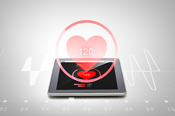 Image showing close up of tablet pc computer with heart rate