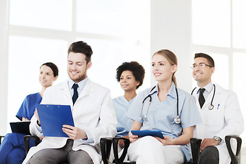 Image showing group of happy doctors on seminar at hospital