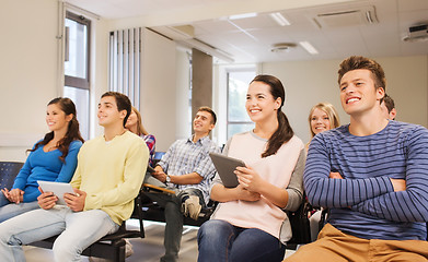 Image showing group of smiling students with tablet pc