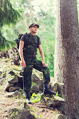 Image showing young soldier with backpack in forest