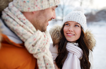 Image showing happy couple walking over winter background