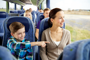 Image showing happy family riding in travel bus