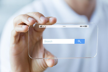 Image showing close up of hand with search bar on smartphone