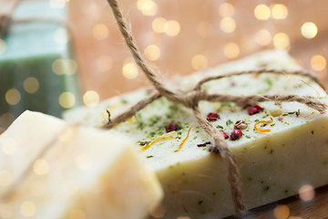 Image showing close up of handmade soap bars on wood