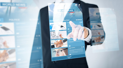 Image showing close up of man pointing finger to world news