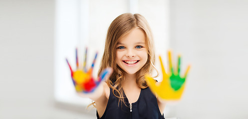 Image showing smiling girl showing painted hands