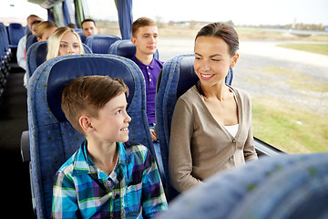 Image showing happy family riding in travel bus