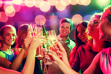 Image showing smiling friends with wine glasses and beer in club