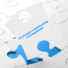 Image showing Advertising concept: Customer Relationship Management on puzzle background