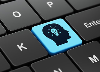 Image showing Advertising concept: Head With Light Bulb on computer keyboard background