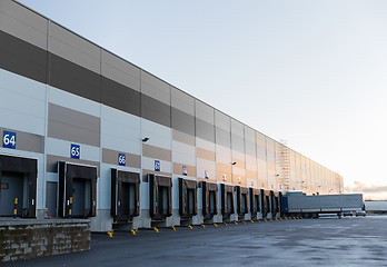 Image showing warehouse gates and truck loading