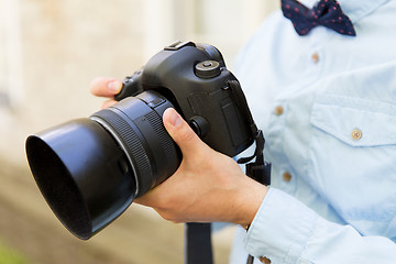 Image showing close up of male photographer with digital camera