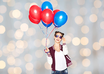 Image showing happy teenage girl with helium balloons