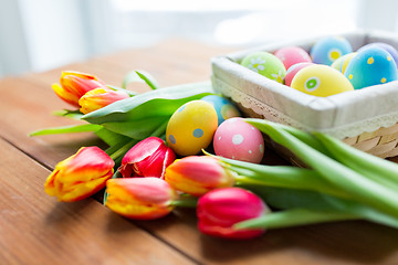 Image showing close up of colored easter eggs and flowers