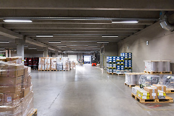 Image showing forklift loader and boxes at warehouse