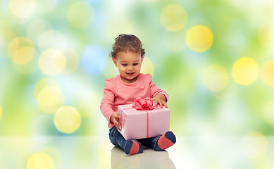 Image showing happy little baby girl with birthday present