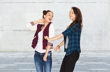 Image showing happy smiling pretty teenage girls dancing