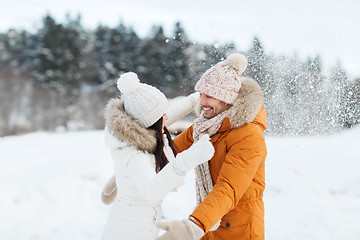 Image showing happy couple hugging and laughing in winter